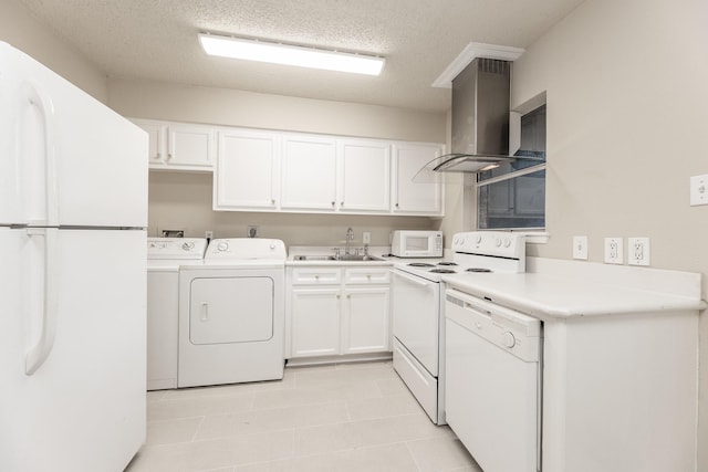 laundry area featuring washer and clothes dryer, light tile patterned flooring, a textured ceiling, and sink