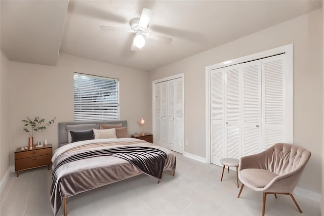 bedroom featuring two closets and ceiling fan