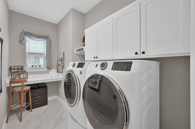 laundry area with cabinets and washing machine and dryer