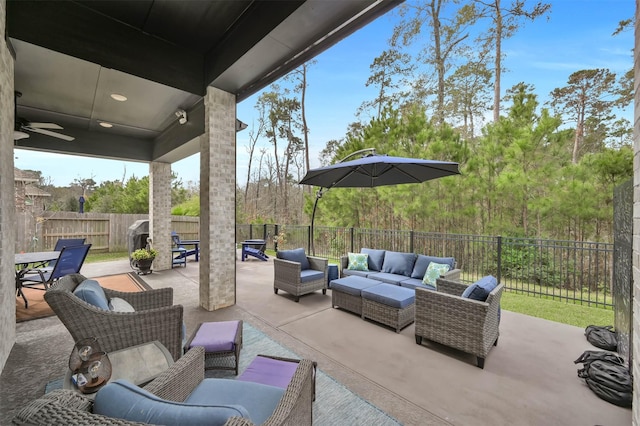 view of patio featuring ceiling fan and an outdoor hangout area