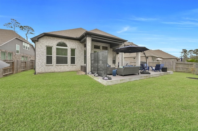 back of house with a lawn, a patio area, and an outdoor hangout area