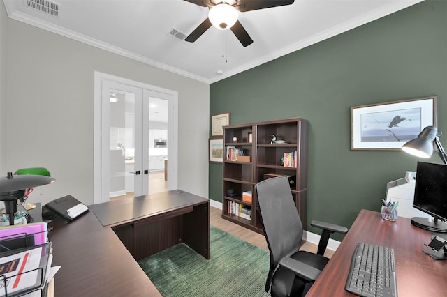 home office with crown molding, french doors, ceiling fan, and wood-type flooring