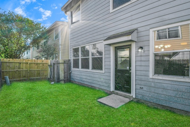 rear view of house with a lawn