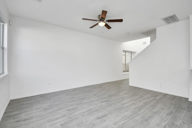 unfurnished living room featuring light hardwood / wood-style floors and ceiling fan