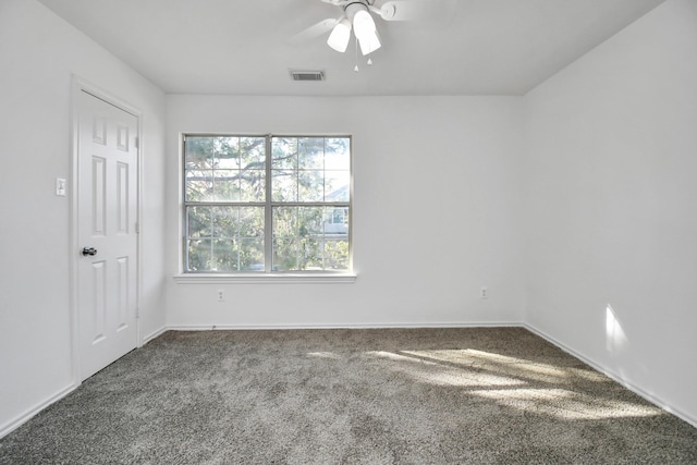 unfurnished room with carpet and ceiling fan