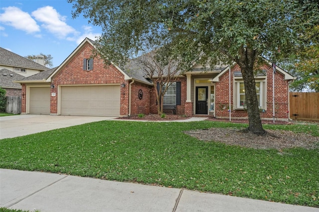 view of front of home with a garage and a front lawn