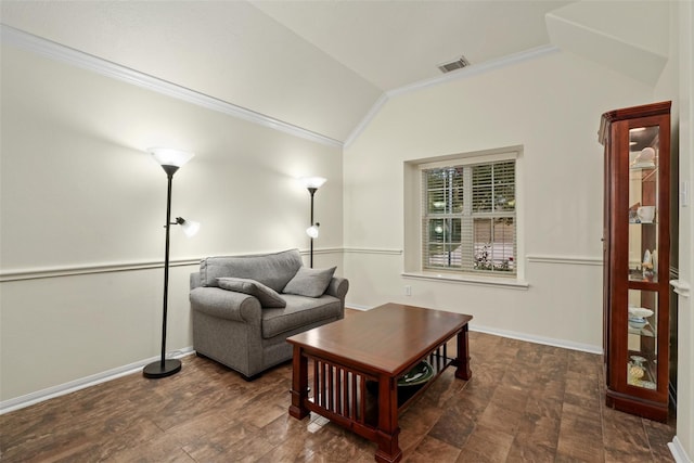 living room with crown molding and vaulted ceiling