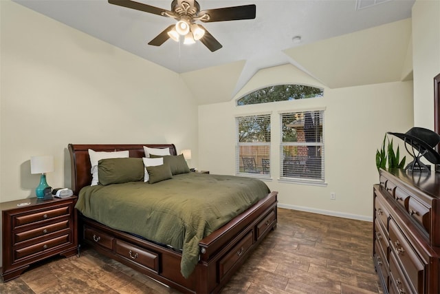 bedroom with dark hardwood / wood-style flooring, ceiling fan, and lofted ceiling