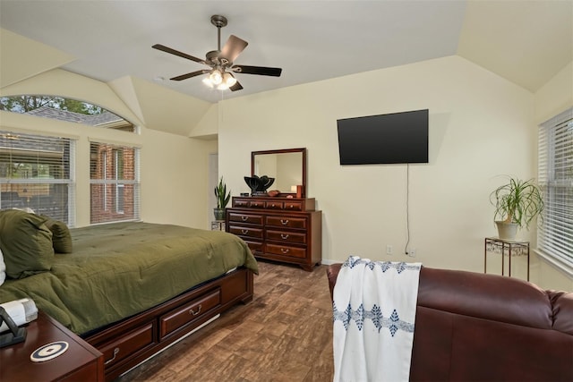 bedroom featuring ceiling fan, dark wood-type flooring, and vaulted ceiling