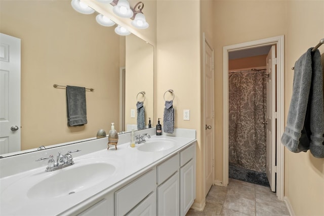 bathroom with tile patterned floors and vanity