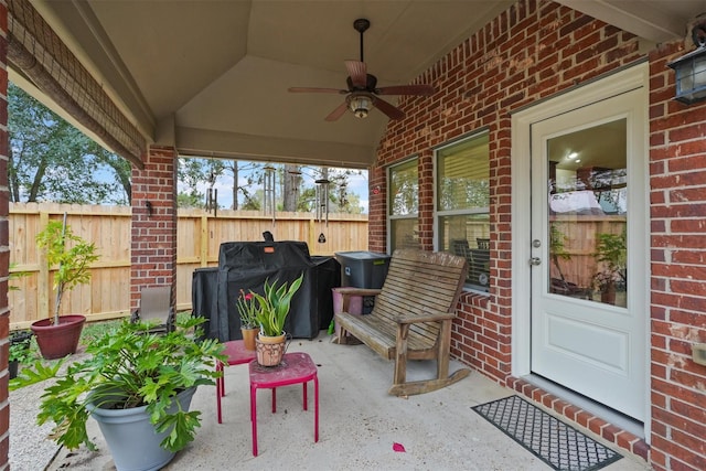 view of patio / terrace with ceiling fan and a grill