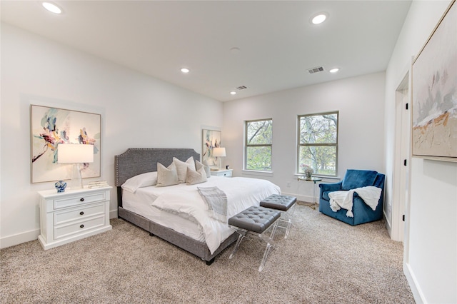 bedroom featuring light carpet