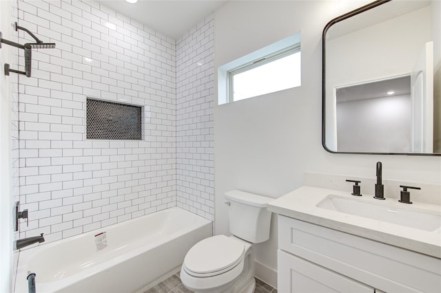 full bathroom with vanity, toilet, and tiled shower / bath