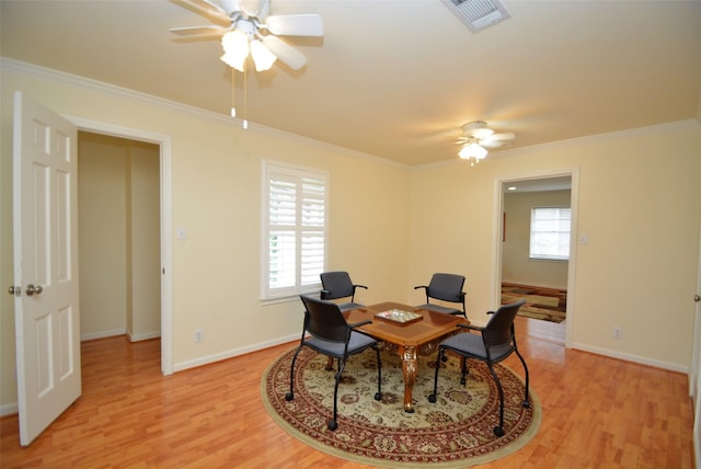 office with light wood-type flooring, ceiling fan, and ornamental molding