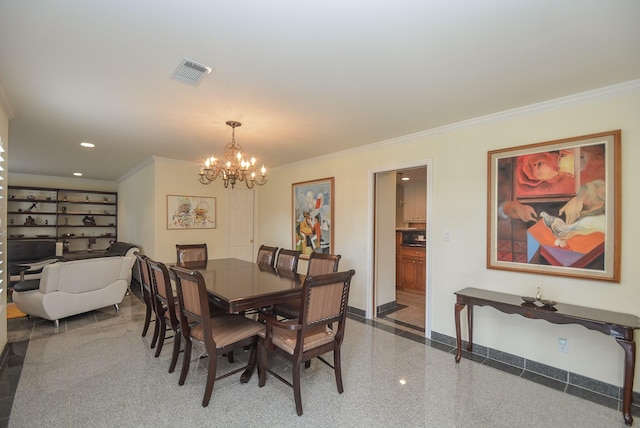 dining room with a notable chandelier and crown molding