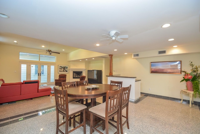 dining room featuring ceiling fan and french doors