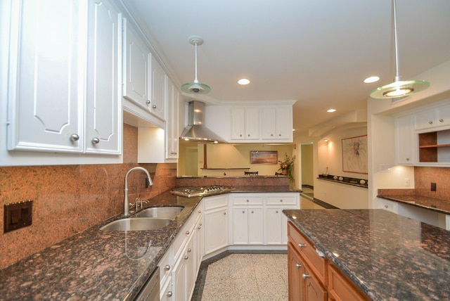 kitchen with white cabinets and wall chimney range hood