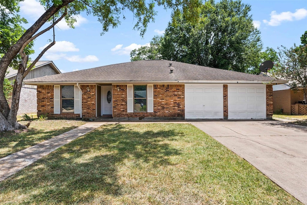 ranch-style house with a garage and a front yard