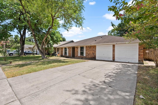 single story home featuring a front yard and a garage