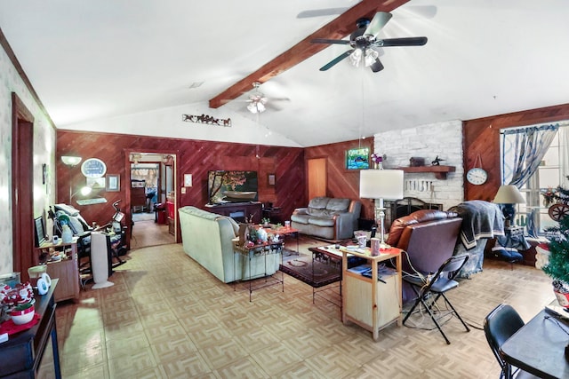 living area featuring vaulted ceiling with beams, ceiling fan, and wooden walls