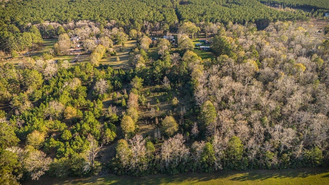 drone / aerial view featuring a forest view