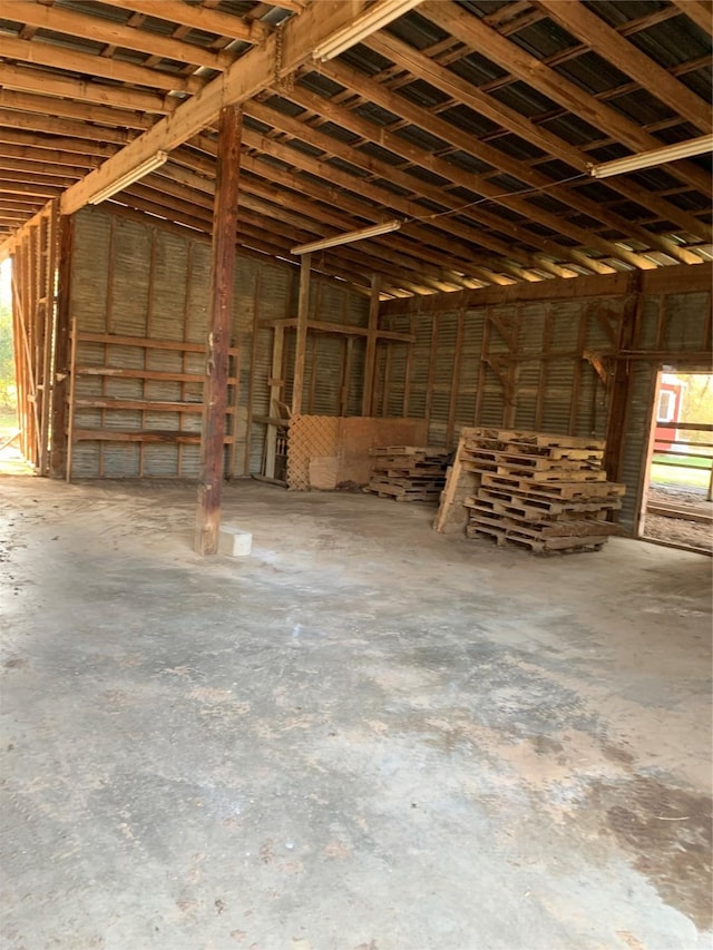 miscellaneous room with unfinished concrete flooring