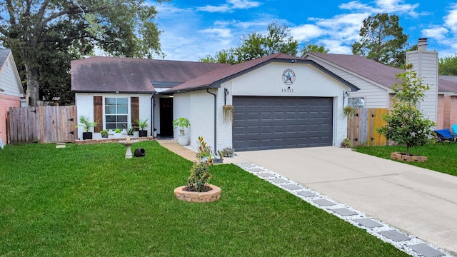 ranch-style home featuring a front yard and a garage