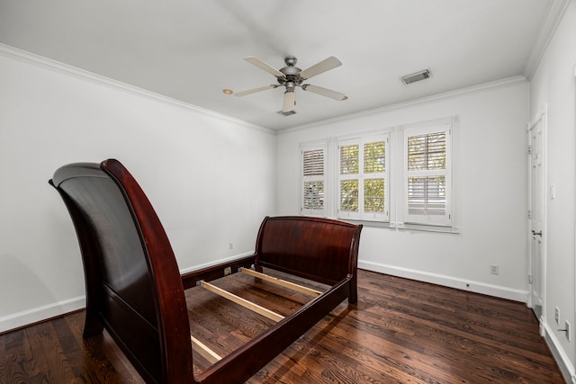 bedroom with ceiling fan, crown molding, and dark wood-type flooring