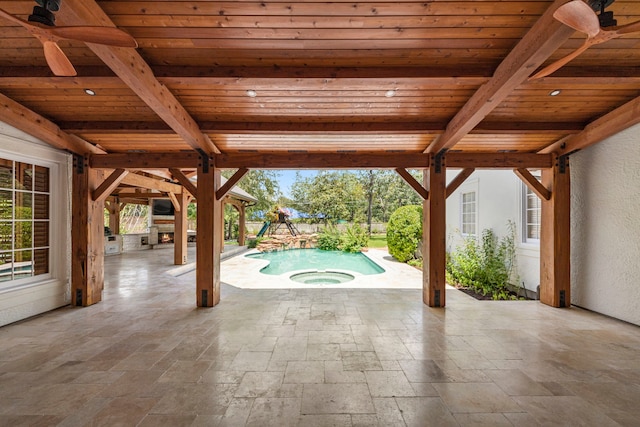 view of pool with a patio area, an in ground hot tub, and ceiling fan