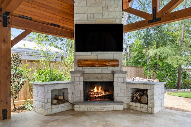 view of patio / terrace with an outdoor stone fireplace