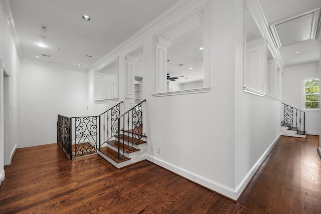 stairway featuring wood-type flooring and ornamental molding