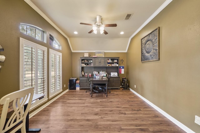 office space with ceiling fan, dark hardwood / wood-style floors, lofted ceiling, and crown molding