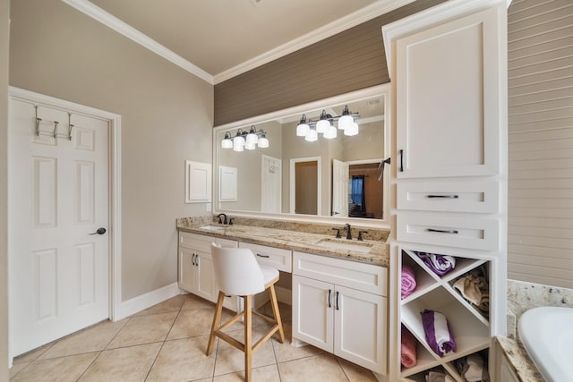 bathroom featuring tile patterned floors, vanity, a bath, and ornamental molding