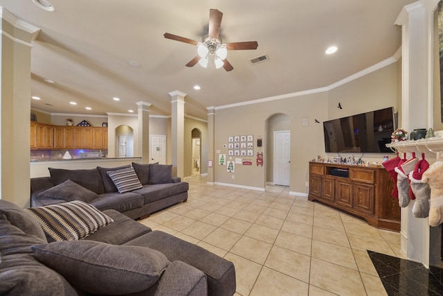 tiled living room featuring ceiling fan and crown molding