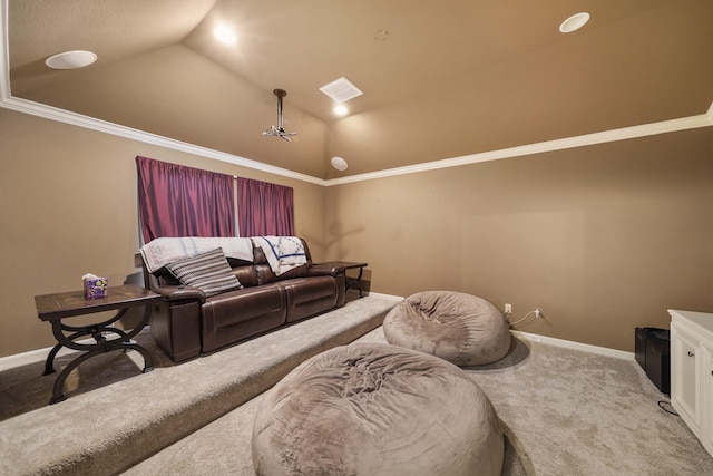 home theater room with carpet flooring, vaulted ceiling, and ornamental molding