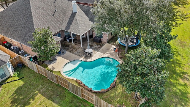 view of pool featuring a patio area and a lawn