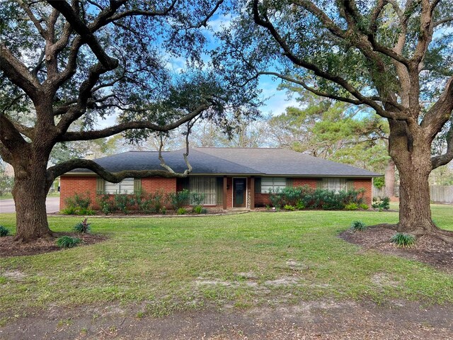 ranch-style home with a front yard