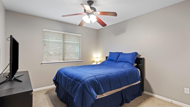 bedroom featuring light carpet and ceiling fan