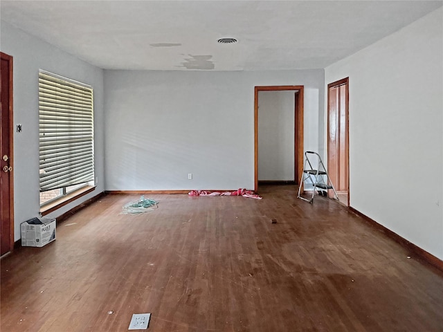 unfurnished room featuring dark hardwood / wood-style floors