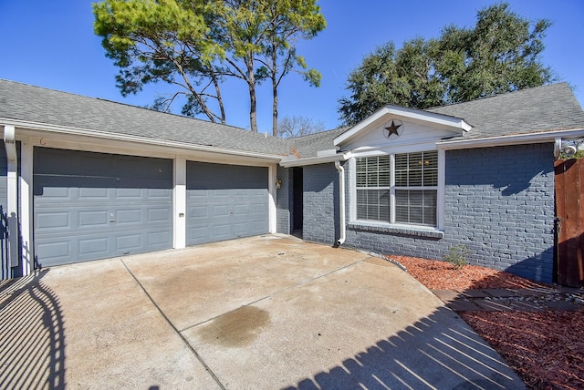 ranch-style home with a garage