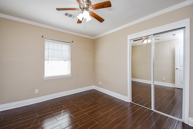 unfurnished bedroom featuring crown molding, a closet, and ceiling fan