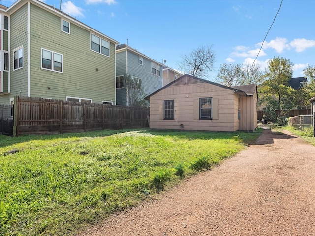 back of property featuring a lawn