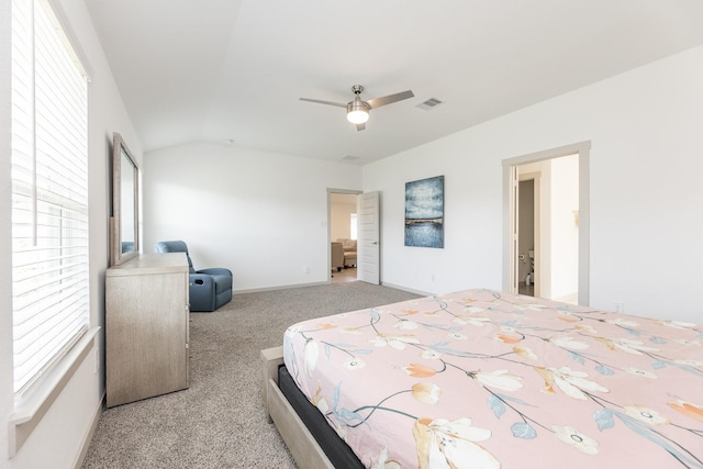 carpeted bedroom with ceiling fan and lofted ceiling