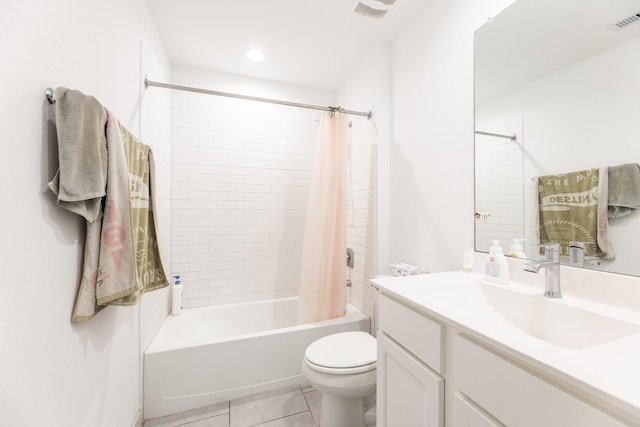 full bathroom featuring tile patterned flooring, shower / bath combination with curtain, toilet, and vanity