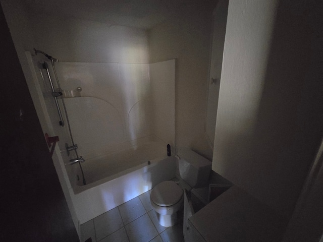 bathroom featuring tile patterned flooring,  shower combination, and toilet