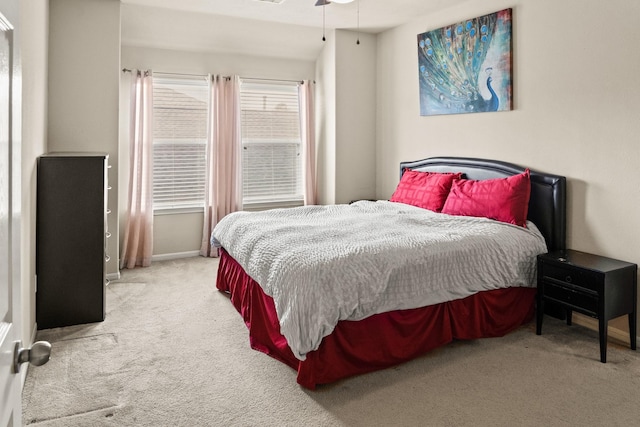 bedroom with light carpet and ceiling fan