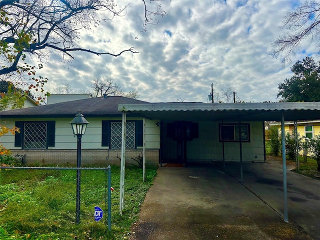 ranch-style house with a carport