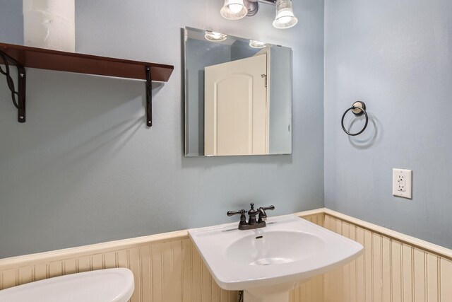 bathroom with toilet and sink