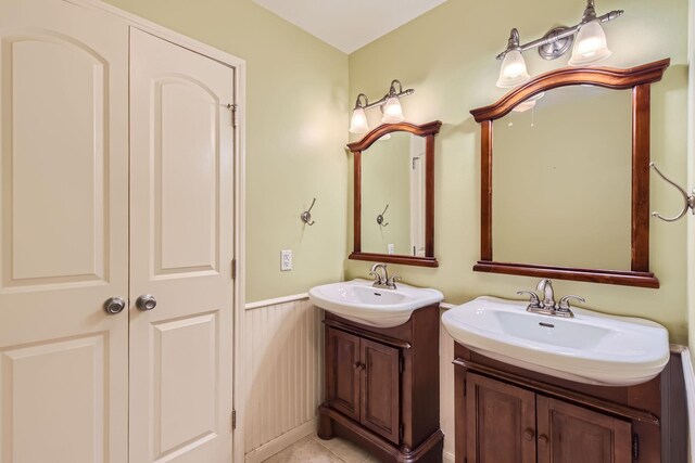 bathroom with tile patterned flooring and vanity