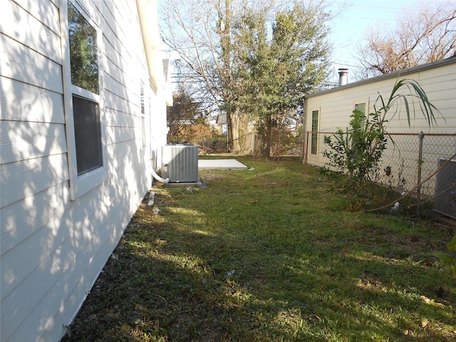 view of yard featuring central AC unit